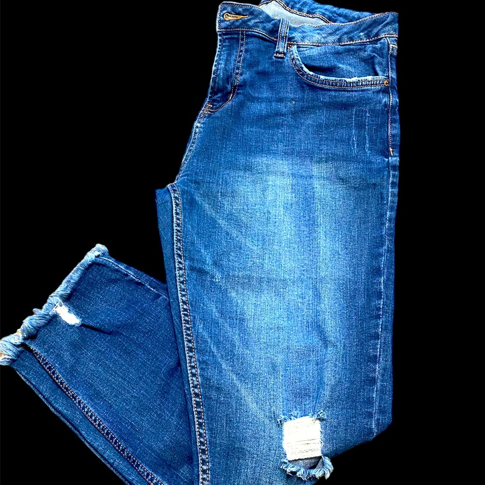 Distressed blue jeans